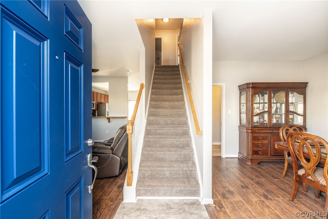 Foyer opens into formal dining room and living roo