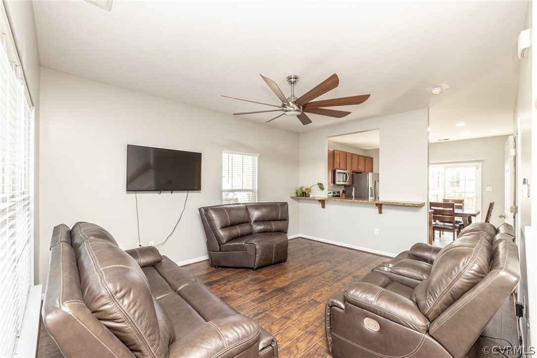Open layout living room with view of kitchen.
