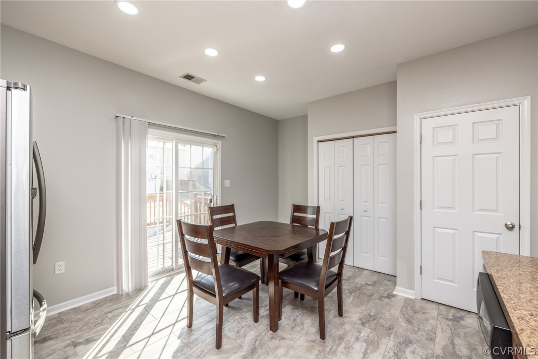 View of dining area in kitchen with sliding doors