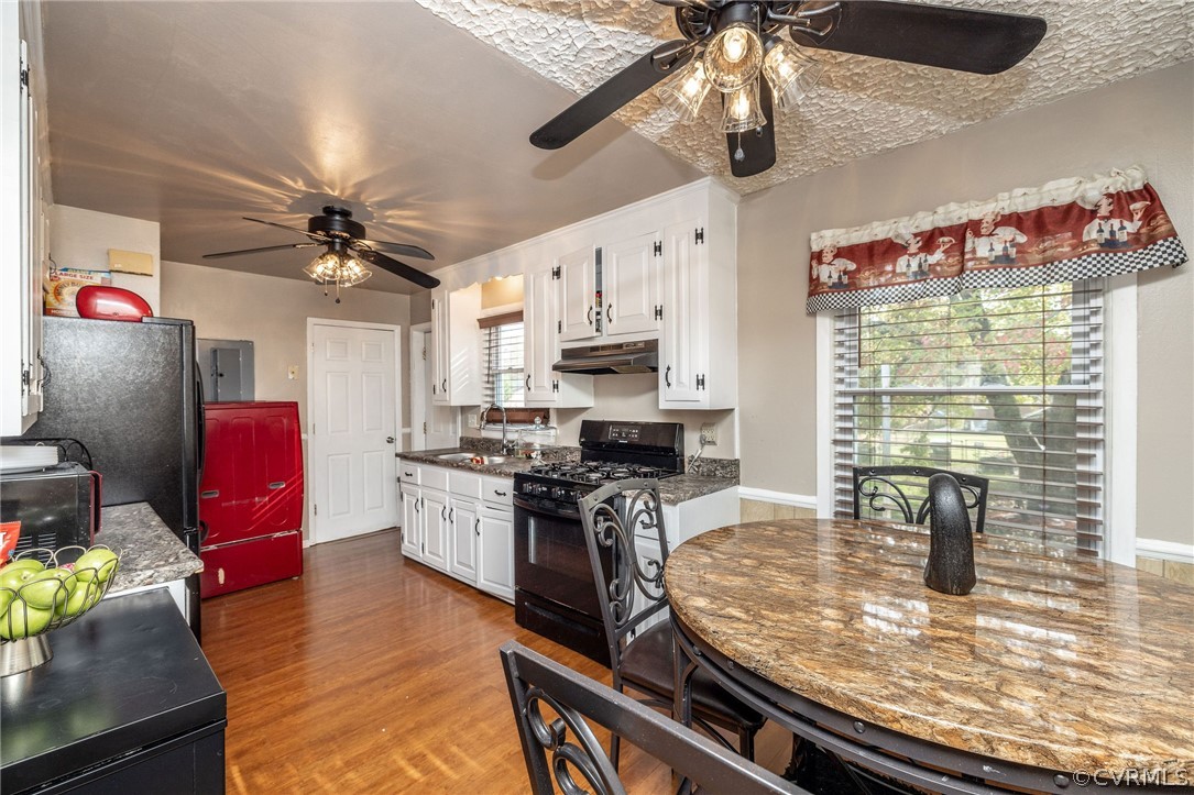 Additional view of kitchen with open layout to din