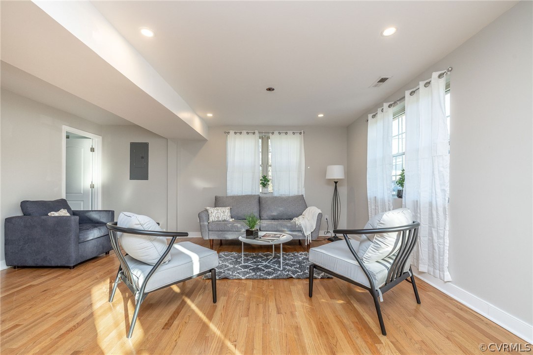 First floor with open living room and hardwood flo
