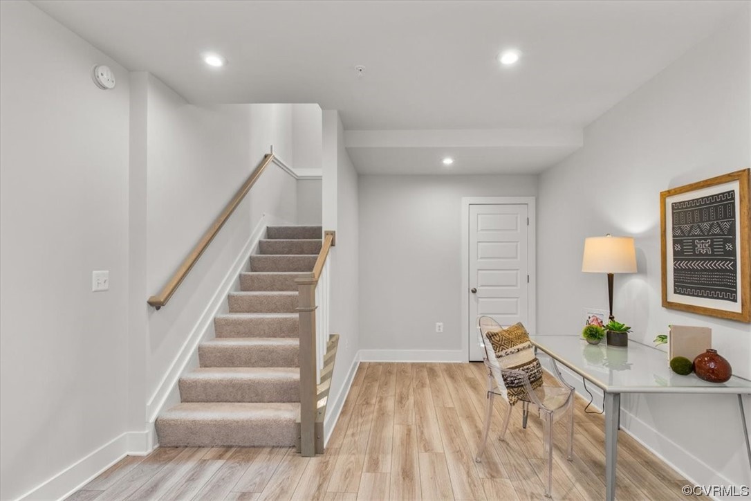 First floor offers foyer, rec room, and direct acc