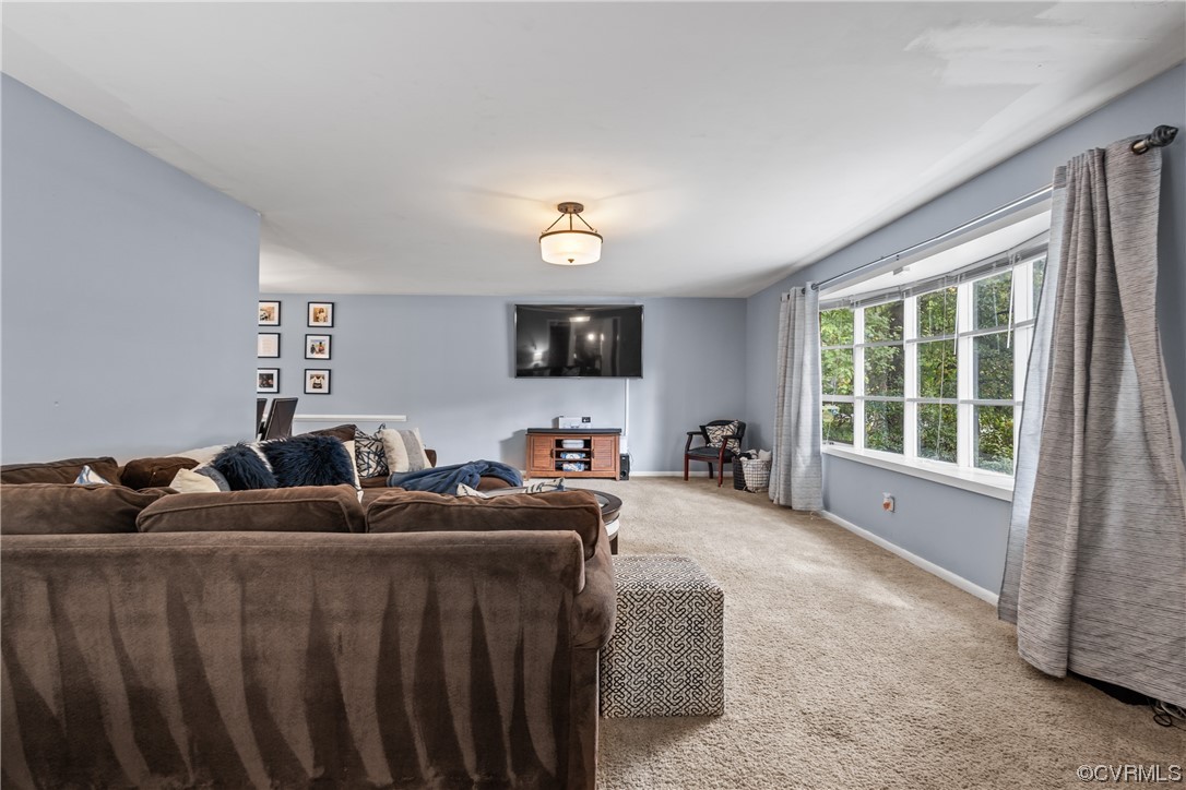 View of living room with picture window from entry