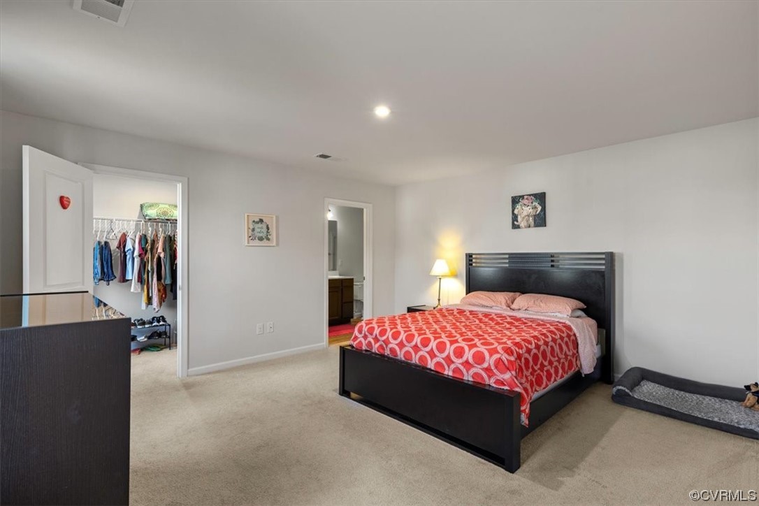 Primary Bedroom with walk-in closet and en-suite b
