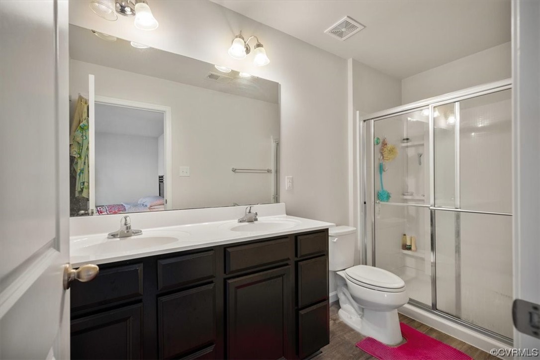 Primary en-suite bathroom with double vanity.
