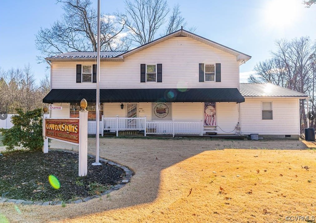 View of front of home with retail downstairs apart