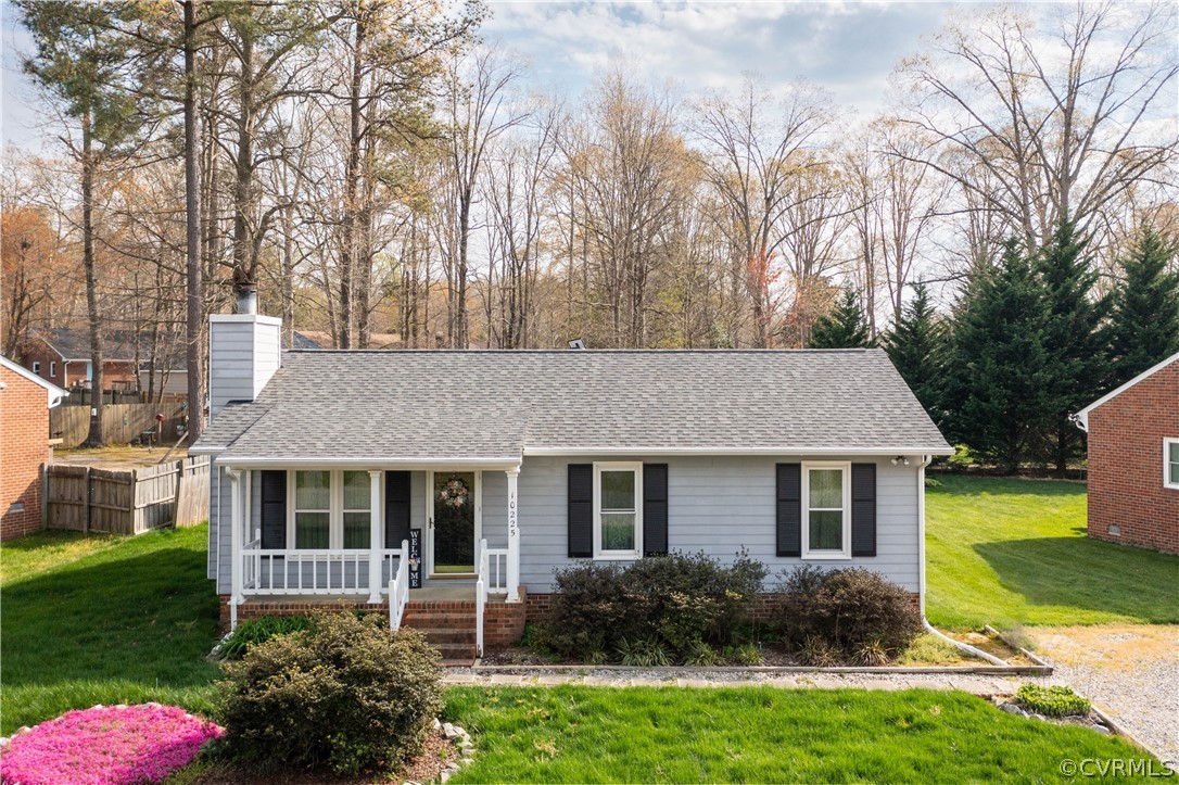 Ranch-style home with a front yard