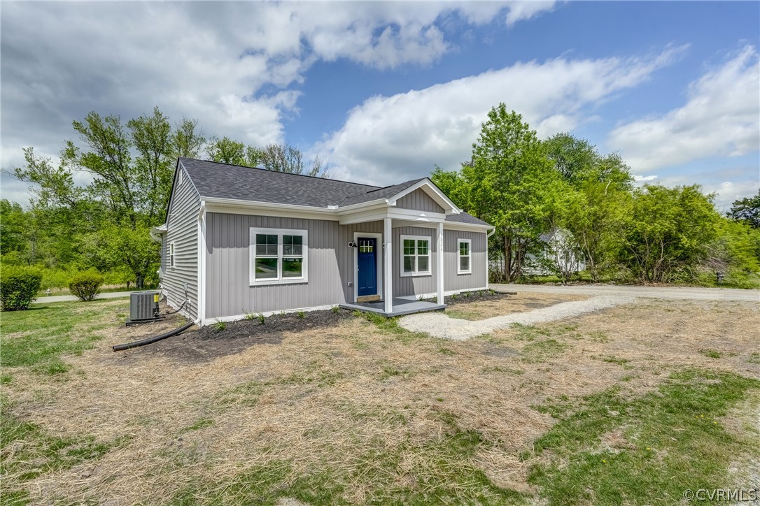 View of front of home featuring central air condit