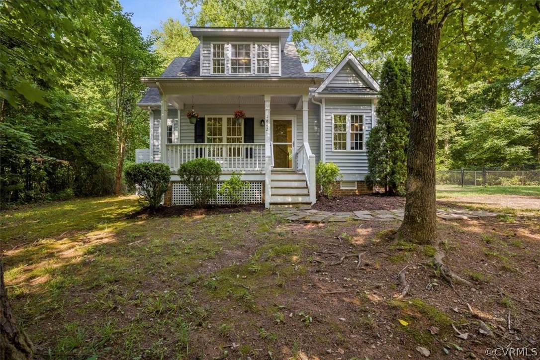 View of front of property featuring a porch
