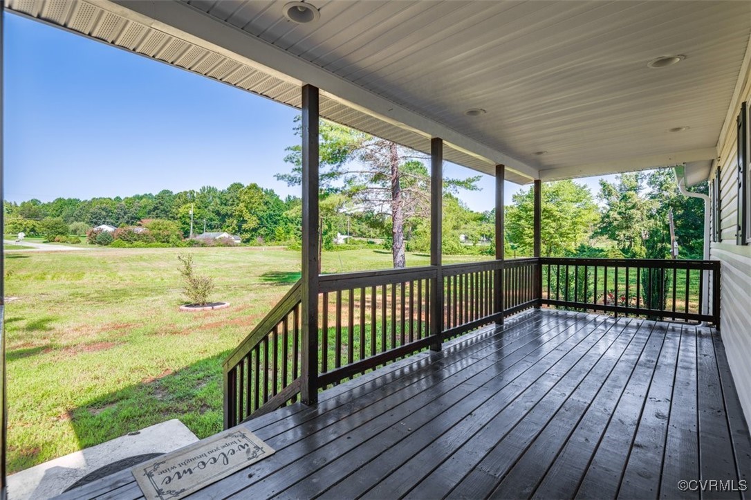 Wooden terrace with a yard