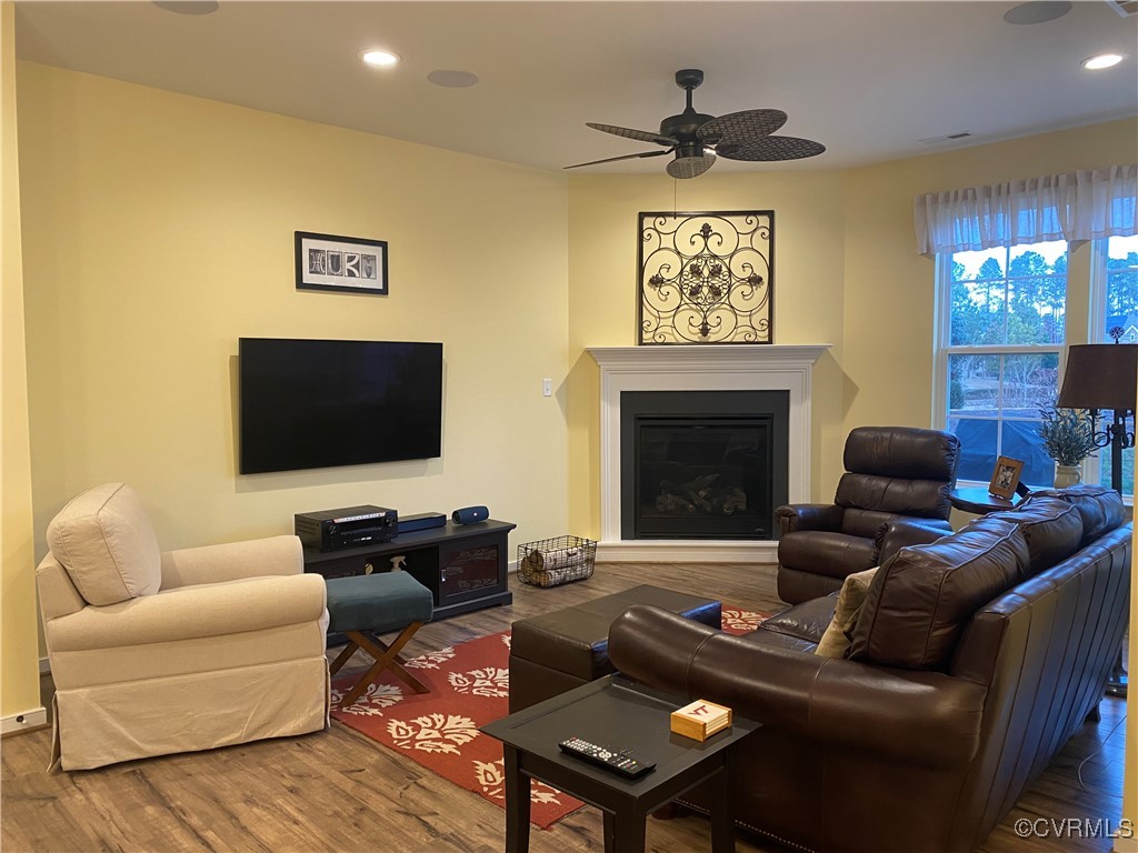 Living room with hardwood / wood-style floors and