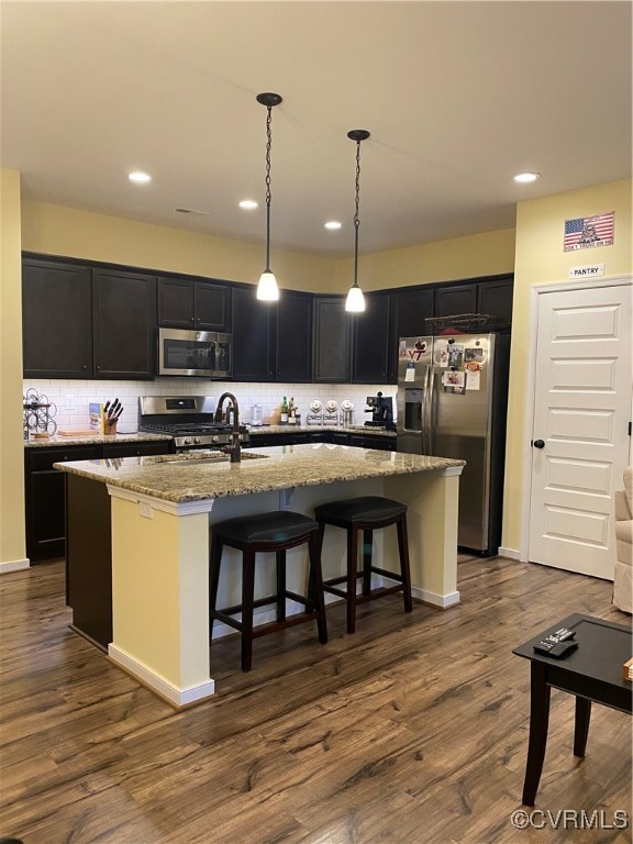 Kitchen with range, dark hardwood / wood-style flo