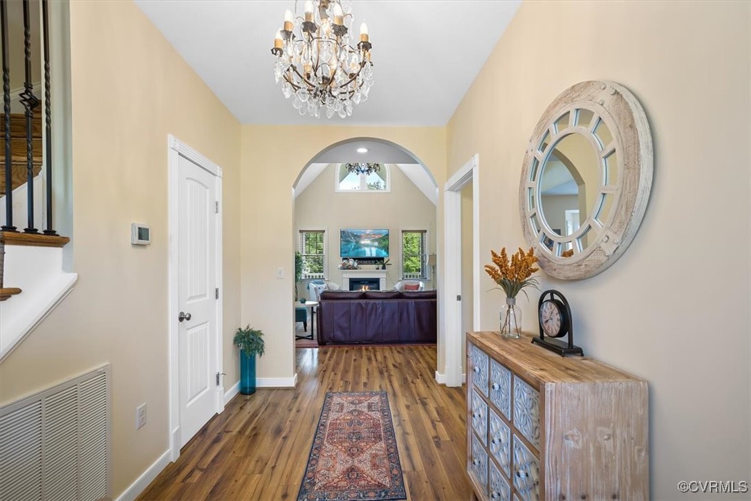 Foyer entrance with dark hardwood / wood-style flo