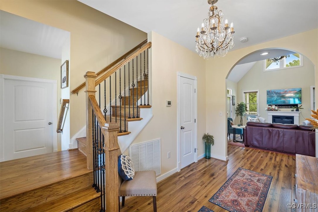 Entrance foyer featuring hardwood / wood-style flo