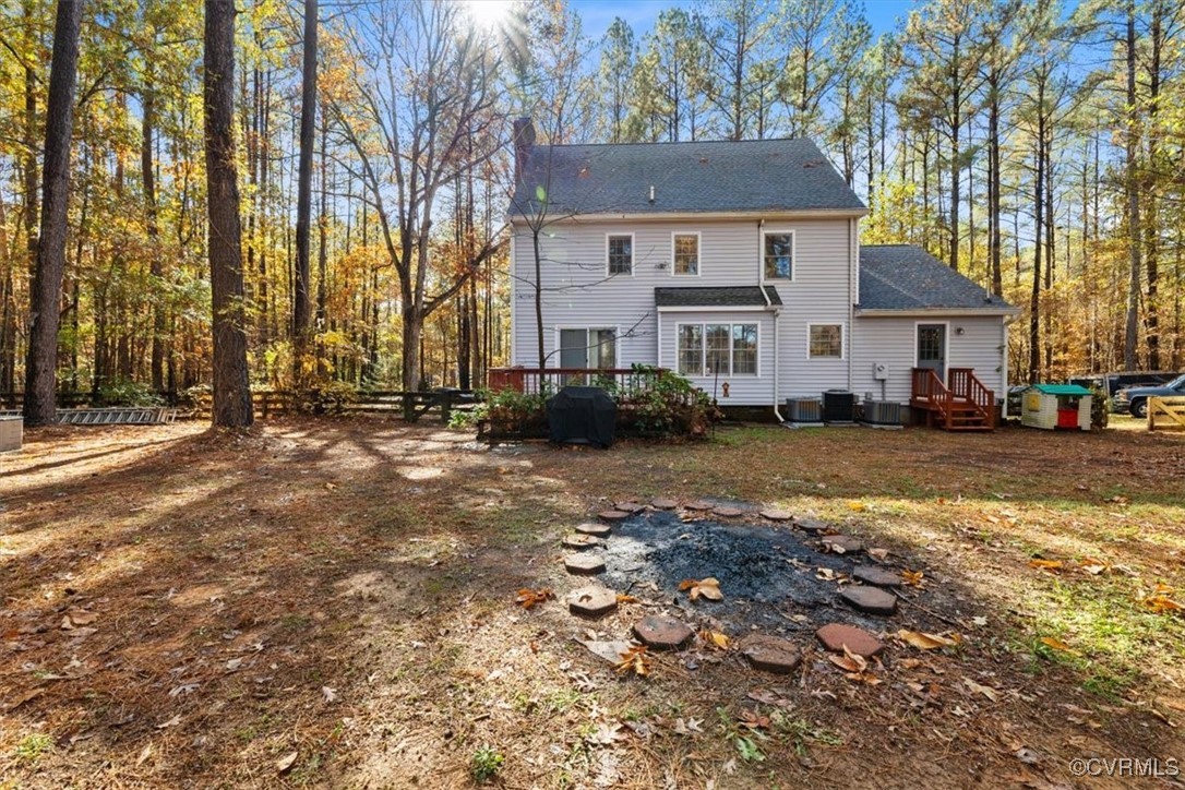2605 Butterwood Dr Back of property featuring a deck and central AC u