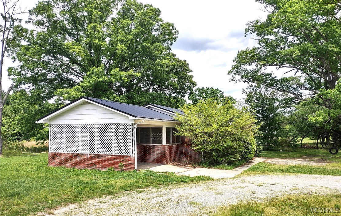 View of side of home with brick siding