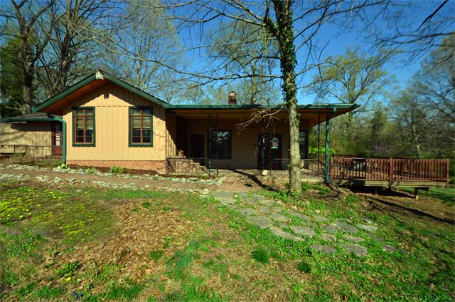 The home was designed with access to the extensive terrace and deck system through French doors from each room.