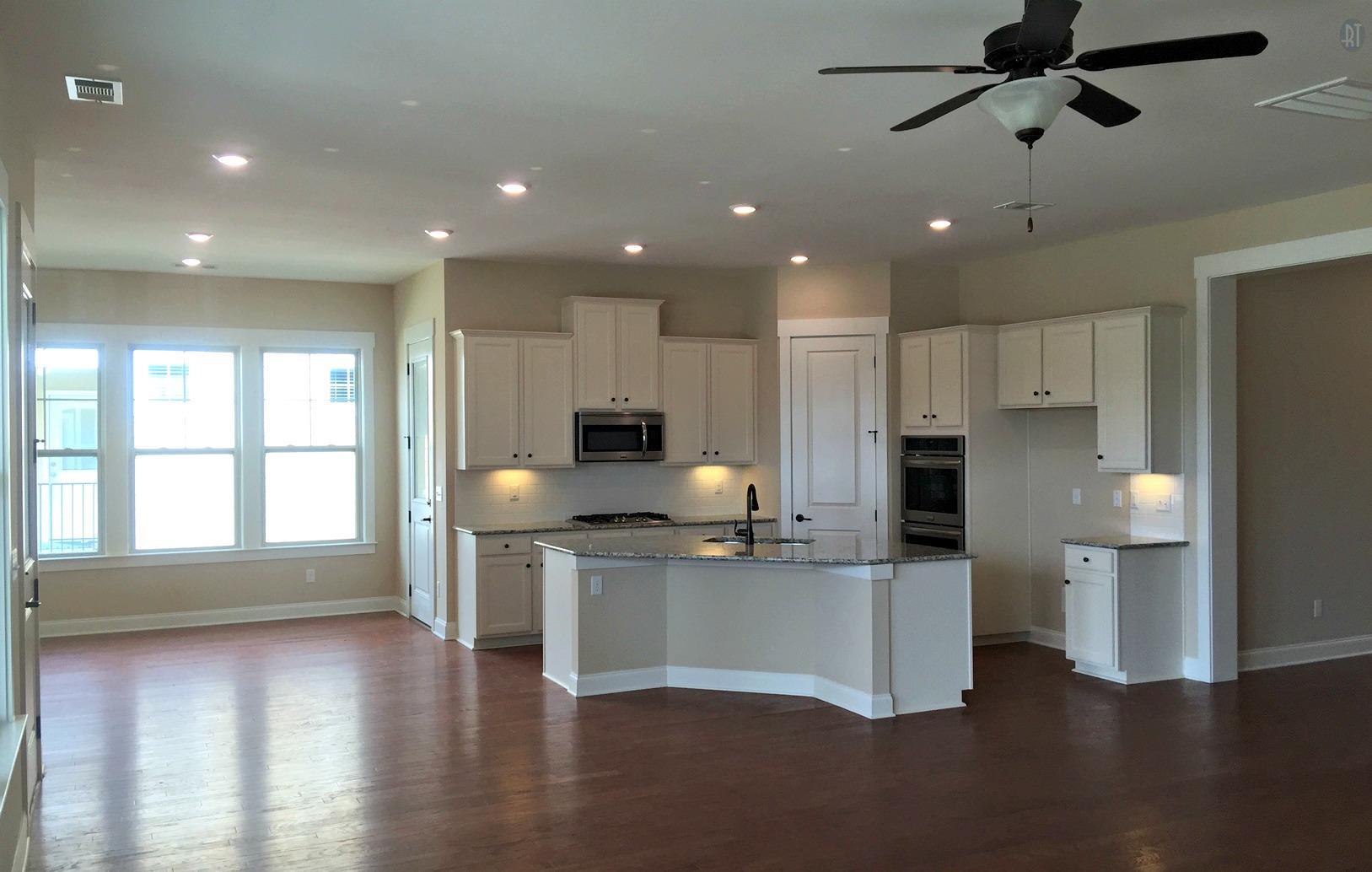 Kitchen and morning room. This is not the home under construction but images from another home of the same floor plan.