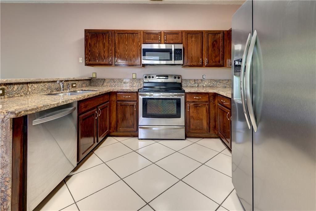 Kitchen with granite counter and stainless steel a