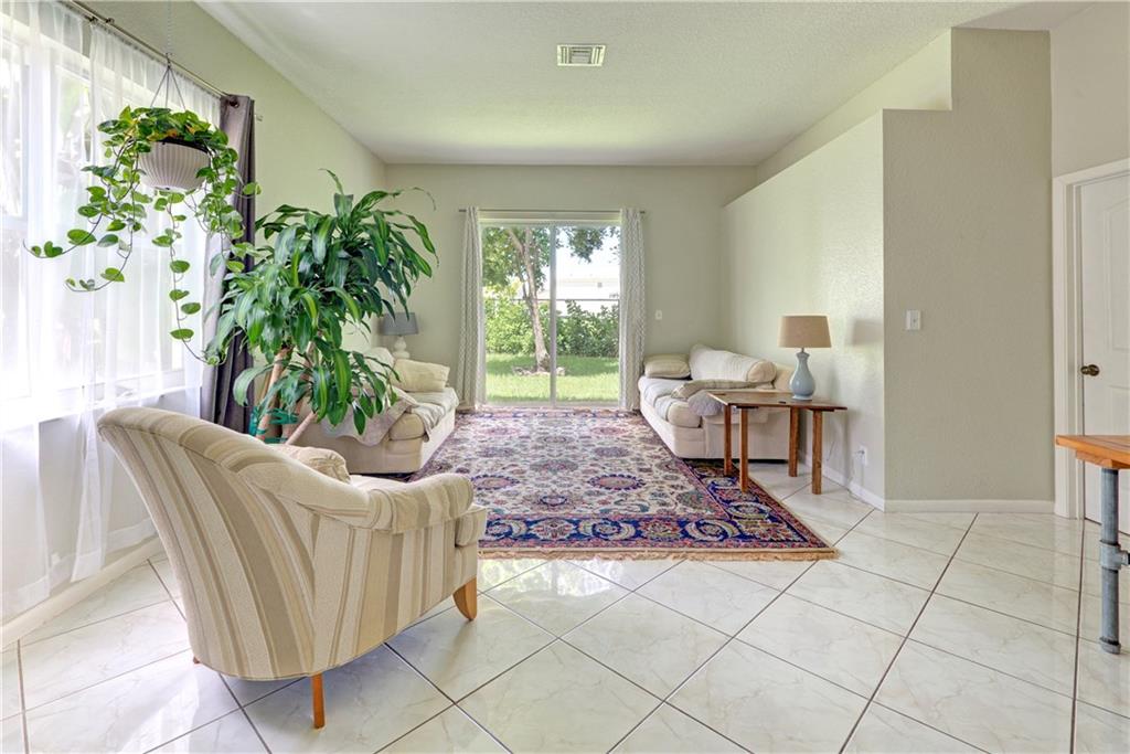 Large living room space overlooking the private ba