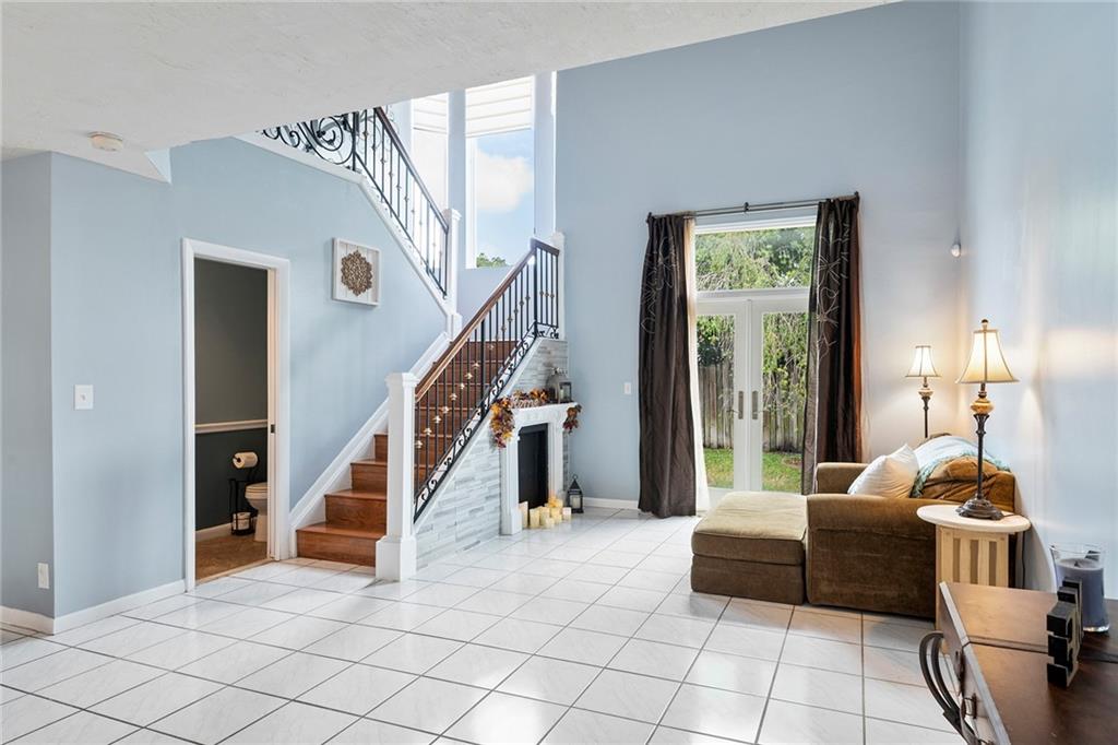 Formal living room with access to the fenced in ba