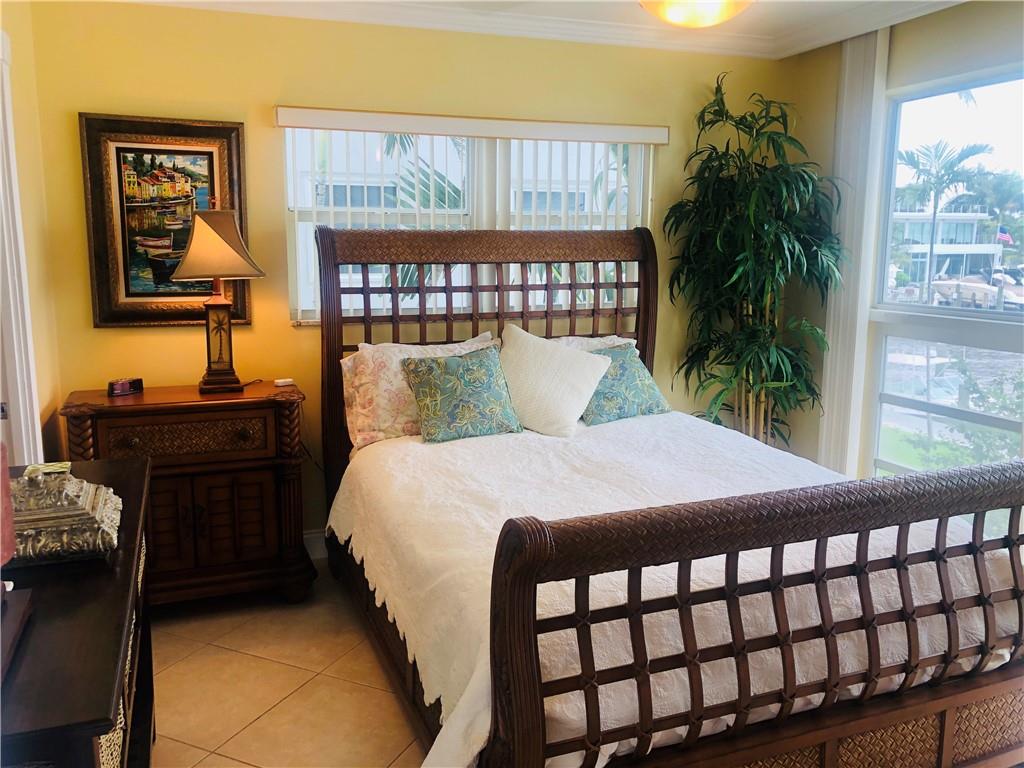 Master Bedroom with floor to ceiling windows overl