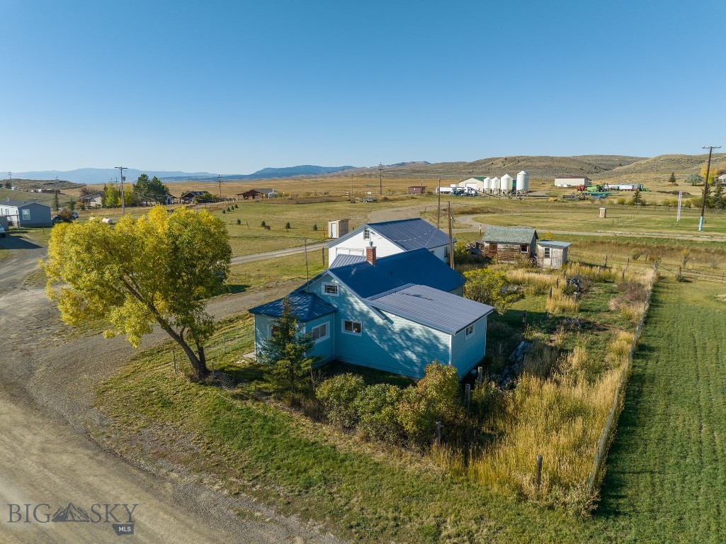 Farm house, large shop/garage and garden shed on .
