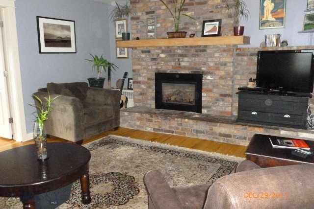 Original brick fireplace with gas fireplace insert