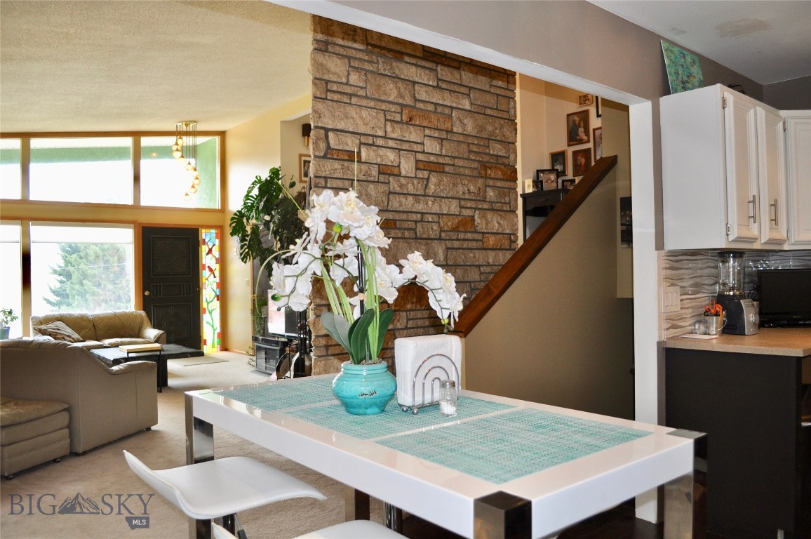 Looking Towards Living Room and Stairs Leading Up