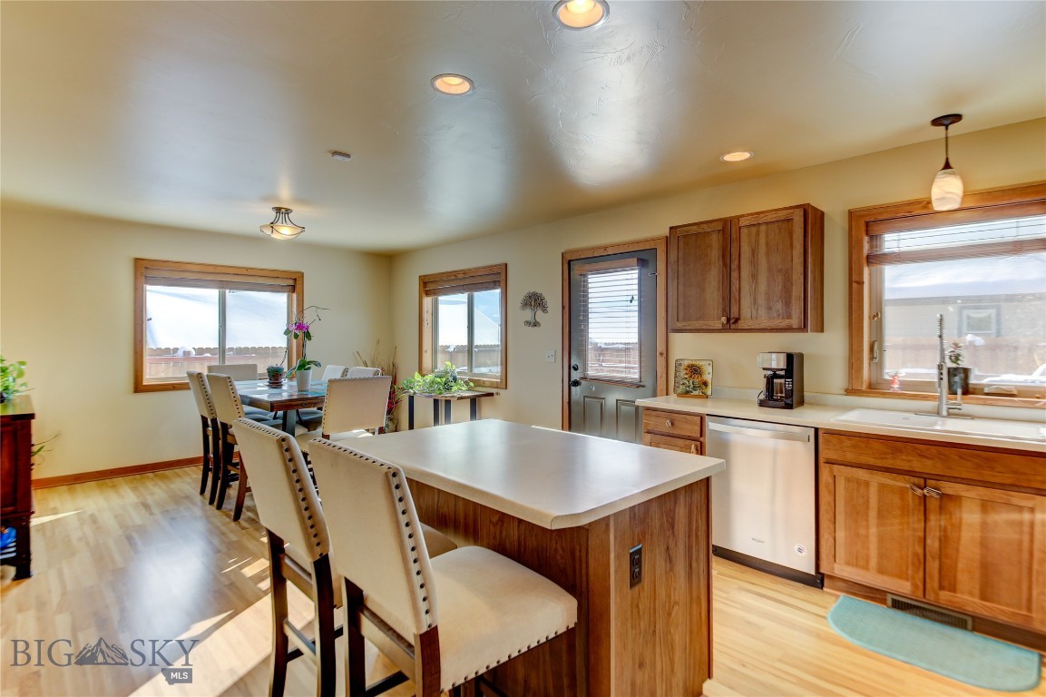 Door leading to backyard patio and views out the w